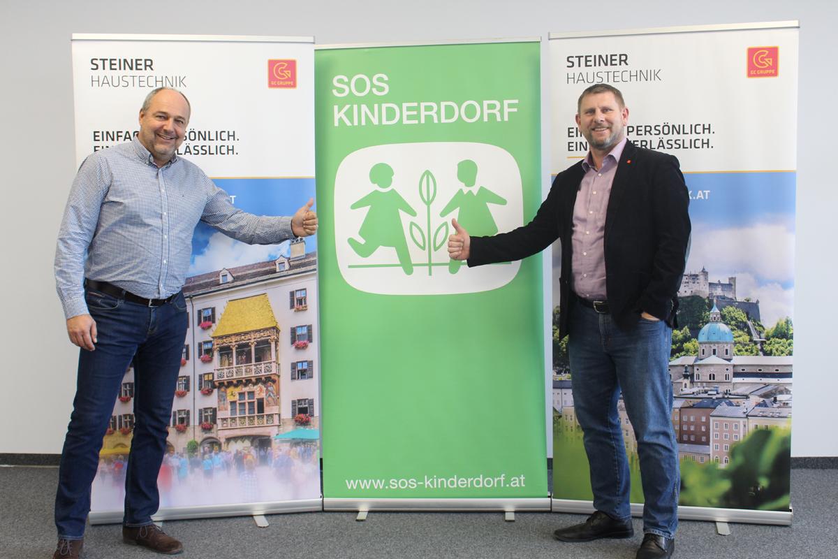 Setzen sich gemeinsam für Kinder ein: Wolfgang Arming, Kinderdorfleiter in Seekirchen, und Andreas Leobacher, PhG der STEINER HAUSTECHNIK 