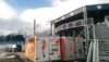 Vor der eindrucksvollen Kulisse des kalten Untersberges erzeugen zwei Mobile Heizanlagen die Wärme für die Rasenheizung. (c) Hotmobil Österreich
